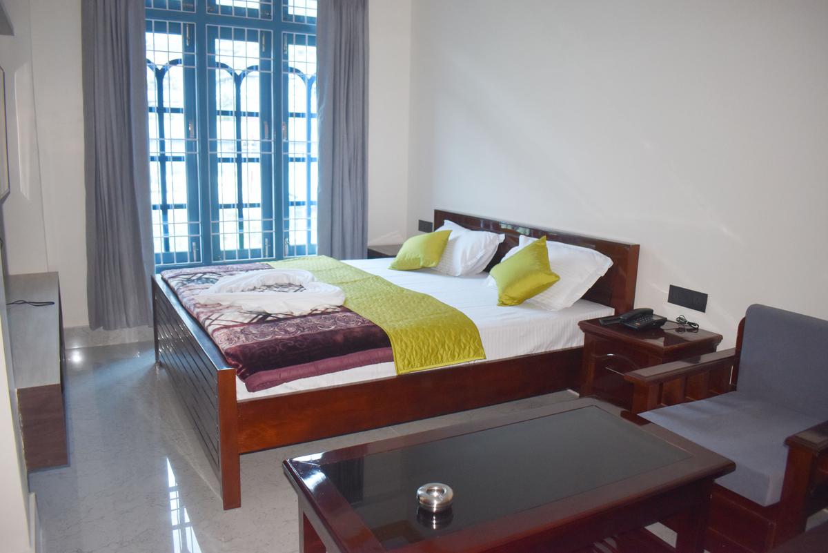 Standard Twin Room at Hotel Pema Lhatse Dirang with two single beds, bedside table, Rs 3000 per night