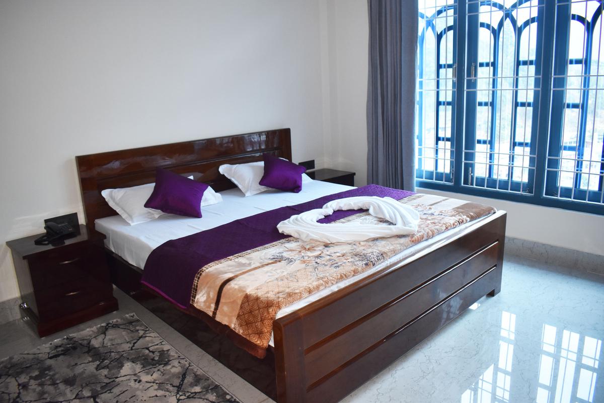 Deluxe Room with purple bedding