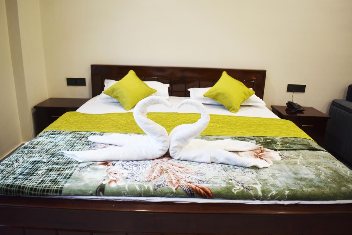 Swan towel art on premium bed in Premium Suite at Hotel Pema Lhatse