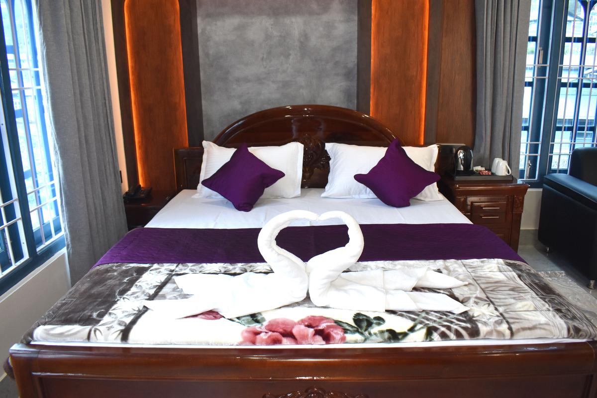 Premium Suite Rs 7000 with designer LED headboard and premium bed at Hotel Pema Lhatse Dirang